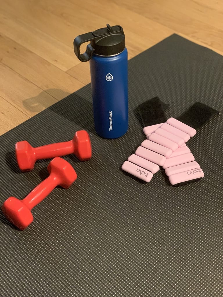 ThermoFlask with weights and a workout mat.
