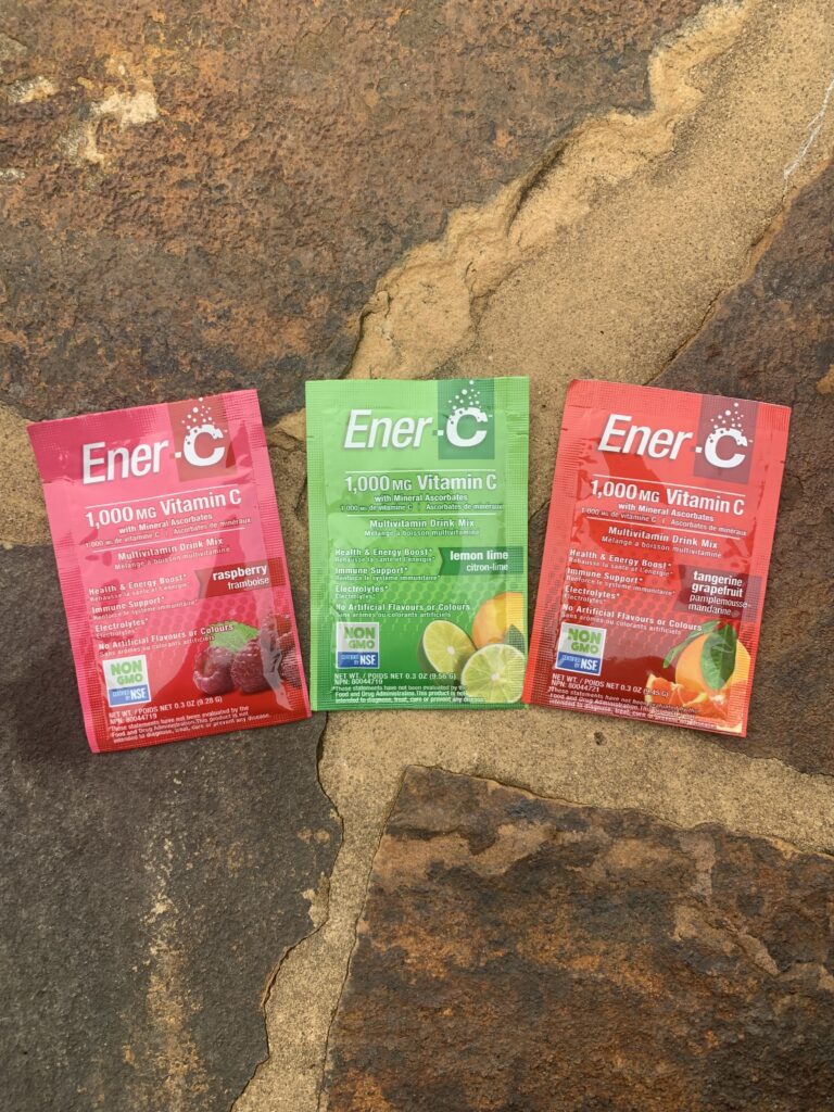Three packets of Ener-C on a stone walkway